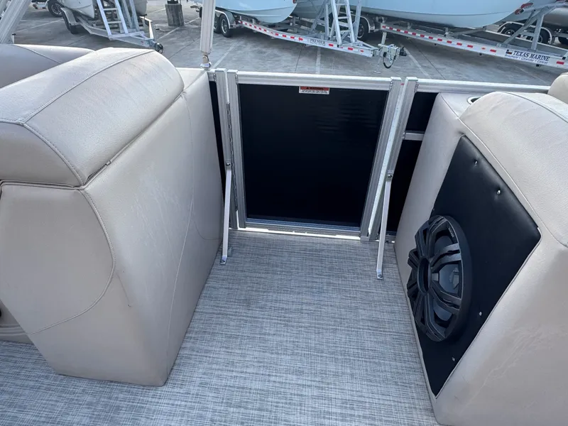 Slide: The Image of Interior of 2017 Avalon LSZ rf 2285 boat with beige seating and speaker system. - 13