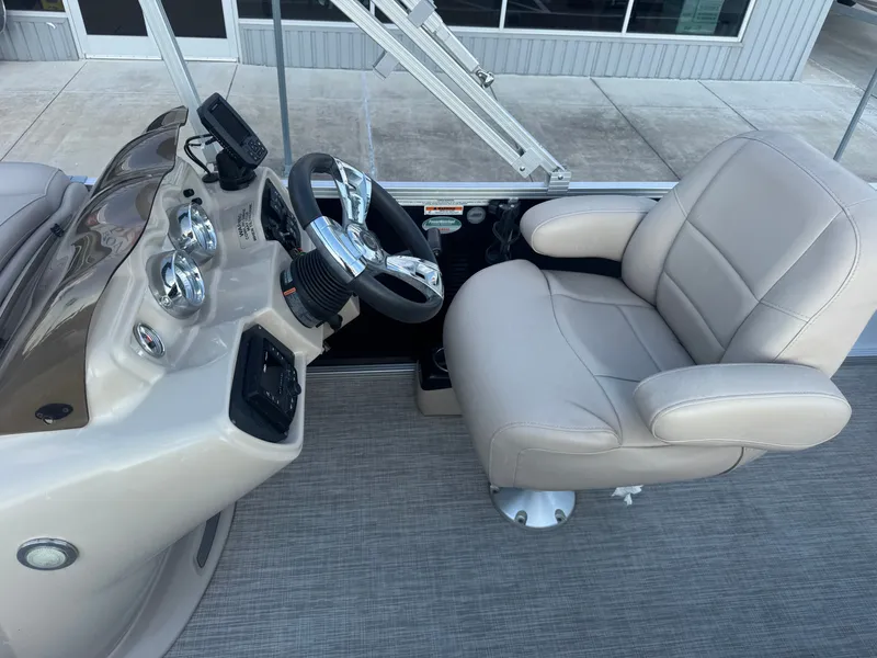 Slide: The Image of 2017 Avalon LSZ rf 2285 boat helm with beige captain's chair and control panel. - 19