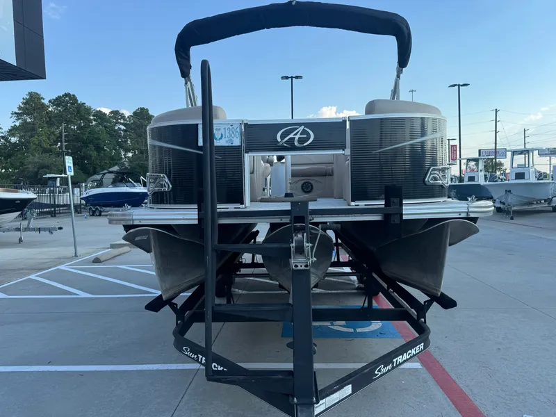 Slide: The Image of 2017 Avalon LSZ rf 2285 pontoon boat on trailer in parking lot. - 9