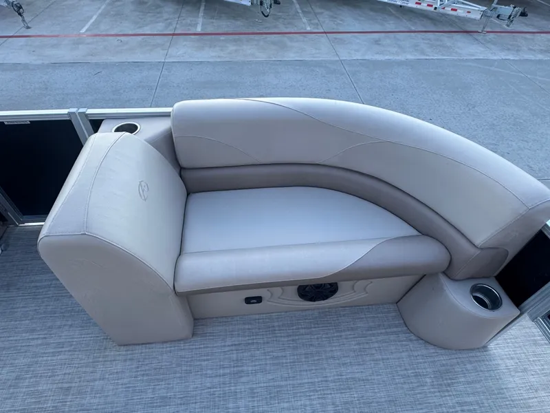 Slide: The Image of Luxurious seating on 2017 Avalon LSZ rf 2285 pontoon boat, featuring cup holders and premium upholstery. - 12