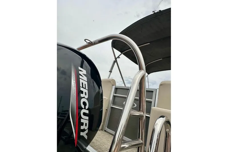 Slide: The Image of 2023 Harris 230 Cruiser boat with Mercury engine, featuring sleek design and comfortable seating. - 10