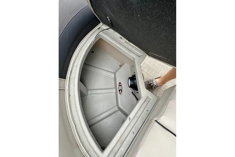 Slide: The Image of Open storage compartment on 2023 Harris 230 CRUISER boat, showing interior details. - 19