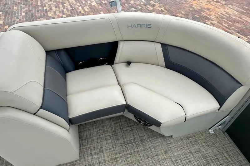 Slide: The Image of Luxurious seating on 2023 Harris 230 Cruiser pontoon boat, featuring elegant beige and gray upholstery. - 33