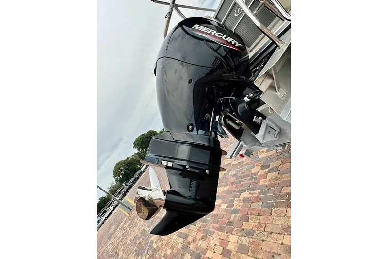 Slide: The Image of Outboard motor on 2023 Harris 230 CRUISER boat, featuring a Mercury engine. - 9