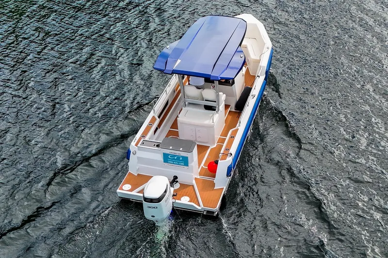 Slide: The Image of 2025 Norseman C280 Center Console boat cruising on water, aerial view. - 4