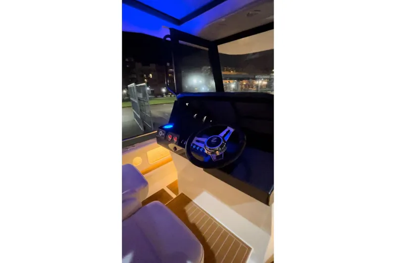 Slide: The Image of 2025 Norseman C280 Center Console interior with illuminated dashboard and steering wheel. - 7