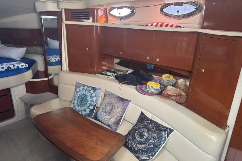 Slide: The Image of Interior of 2008 Sea Ray 340 Sundancer with cozy seating and decorative pillows. - 13