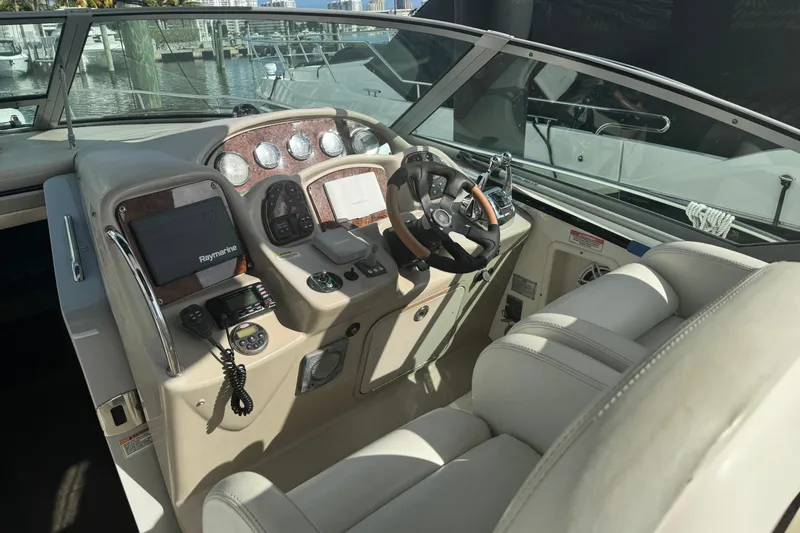Slide: The Image of Helm of 2008 Sea Ray 340 Sundancer with modern controls and navigation equipment. - 9