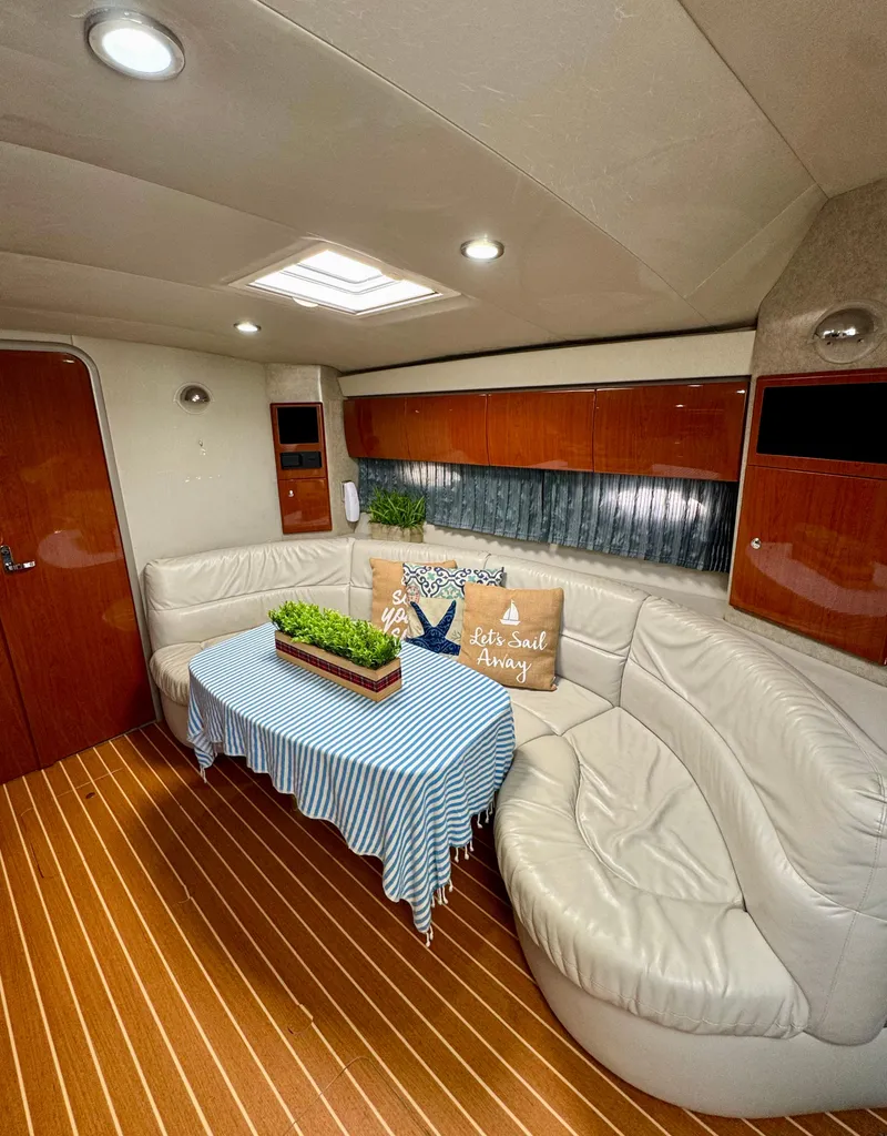 Slide: The Image of Luxurious 2006 Formula 40pc yacht interior with elegant seating and wooden flooring. - 16