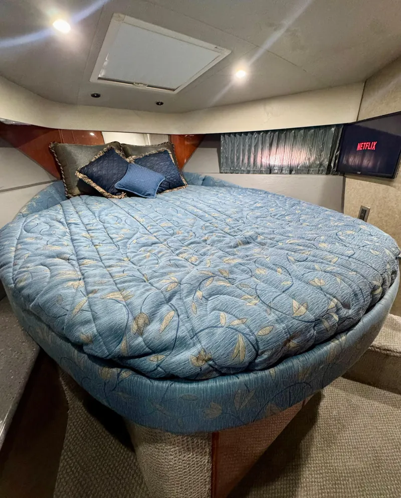 Slide: The Image of Cozy bedroom in 2006 Formula 40pc yacht with blue bedding and Netflix on TV. - 18