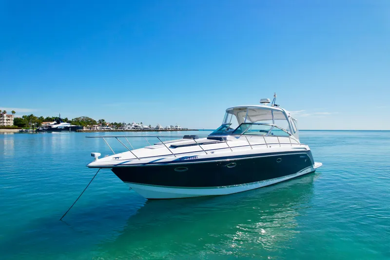 Slide: The Image of 2006 Formula 40pc yacht on clear blue water under a sunny sky. - 2