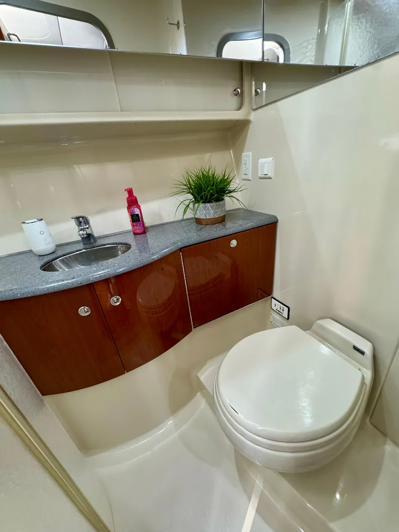 Slide: The Image of 2006 Formula 40pc yacht bathroom with sink, toilet, and storage cabinets. - 21