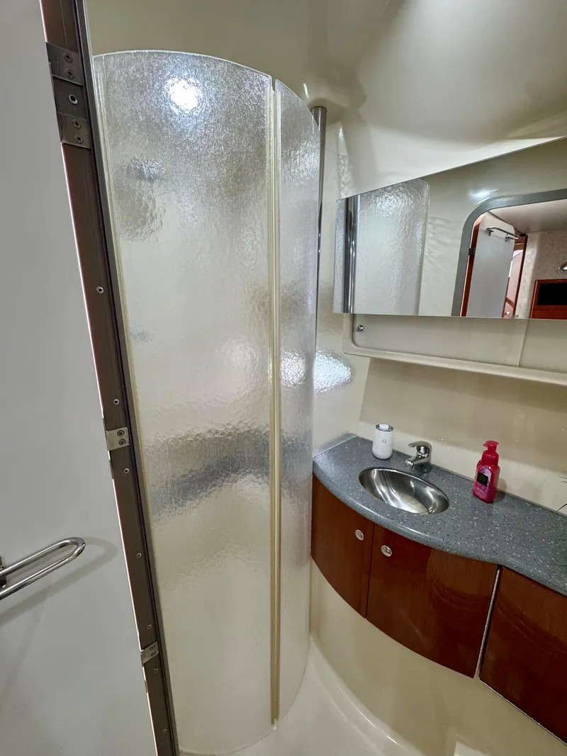 Slide: The Image of 2006 Formula 40pc yacht bathroom with shower, sink, and mirror. - 33