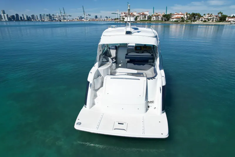 Slide: The Image of 2006 Formula 40 Performance Cruiser on calm water with city skyline backdrop. - 43