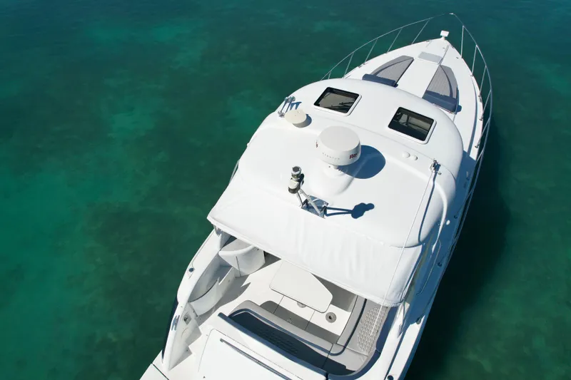 Slide: The Image of 2006 Formula 40 Performance Cruiser on clear turquoise water, aerial view. - 44