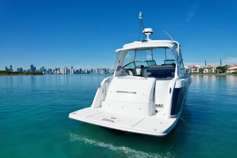Slide: The Image of 2006 Formula 40 Performance Cruiser on calm water with city skyline in background. - 45