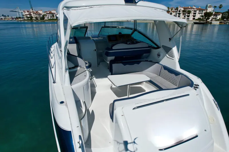 Slide: The Image of 2006 Formula 40 Performance Cruiser with spacious deck and seating, docked in serene waters. - 47