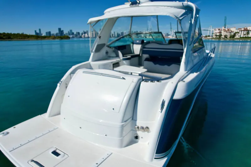 Slide: The Image of 2006 Formula 40 Performance Cruiser on calm water with city skyline in background. - 49
