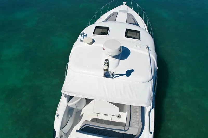Slide: The Image of 2006 Formula 40pc yacht on clear turquoise water, aerial view. - 9