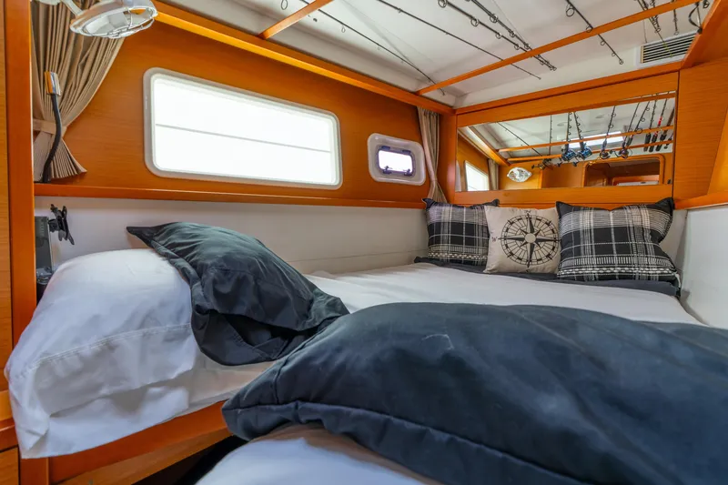 Slide: The Image of Cozy cabin interior of 2013 Lagoon 450 yacht with nautical-themed decor. - 105