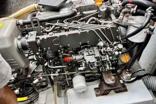 Slide: The Image of 2013 Lagoon 450 catamaran docked at marina, featuring sleek design and spacious deck. - 11