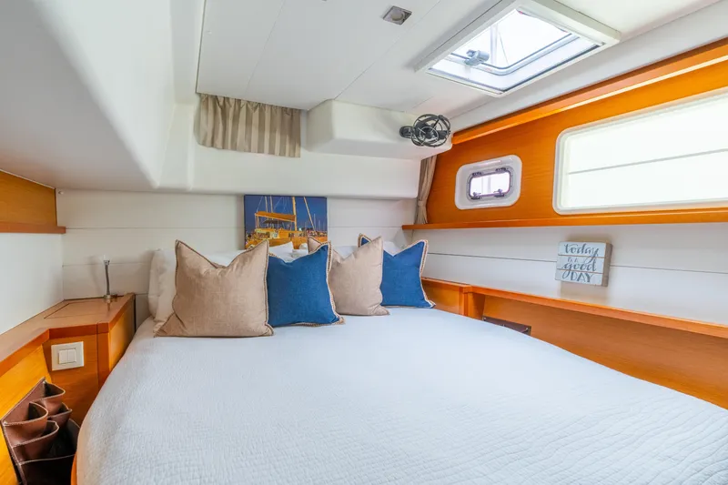 Slide: The Image of Luxurious cabin interior of 2013 Lagoon 450 catamaran with cozy bedding and natural light. - 112