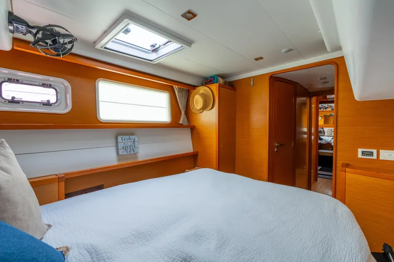 Slide: The Image of Cozy cabin interior of 2013 Lagoon 450 catamaran with wood finish and natural light. - 113
