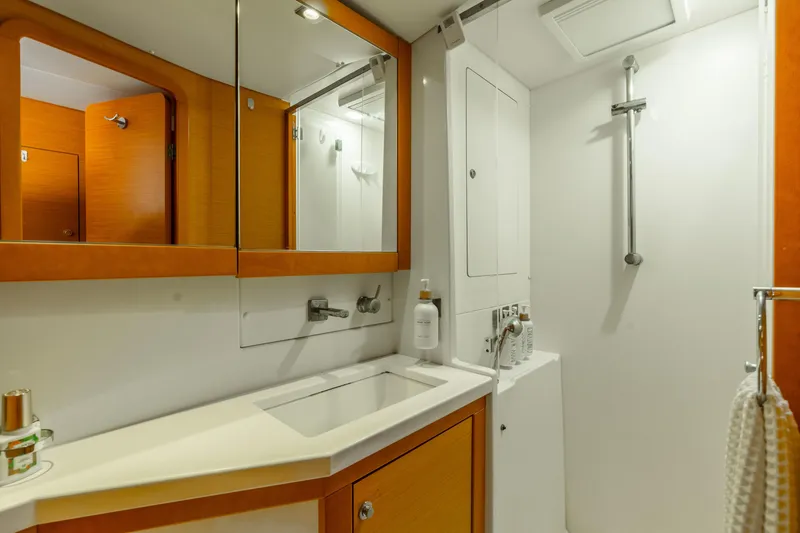 Slide: The Image of Luxurious bathroom in 2013 Lagoon 450 yacht with modern fixtures and wooden accents. - 116