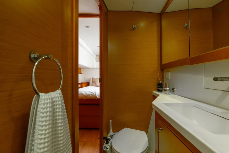Slide: The Image of Luxurious bathroom interior on 2013 Lagoon 450 yacht, featuring modern fixtures and wooden accents. - 117