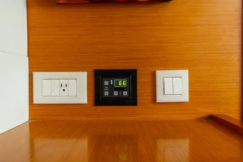 Slide: The Image of Electrical panel with outlets and digital display on Lagoon 450, 2013 model yacht. - 121