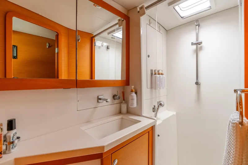 Slide: The Image of Luxurious bathroom in 2013 Lagoon 450 yacht with modern fixtures and ample storage. - 129