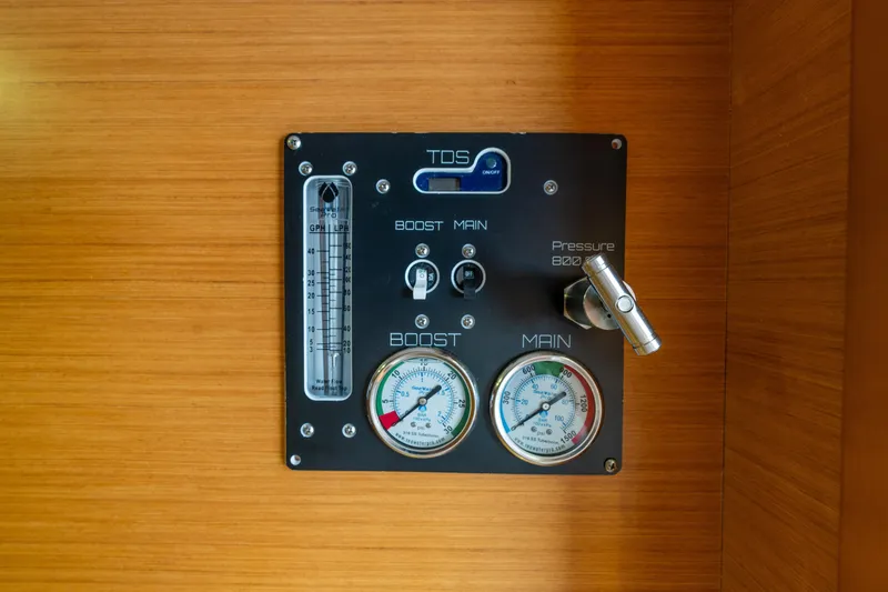 Slide: The Image of Control panel on a 2013 Lagoon 450 yacht, featuring gauges and switches. - 133