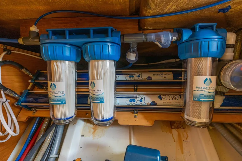 Slide: The Image of Water filtration system in a 2013 Lagoon 450 yacht, featuring SeaWater Pro components. - 136