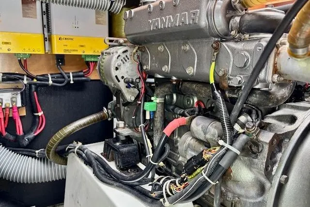 Slide: The Image of 2013 Lagoon 450 catamaran docked at marina, overcast sky, calm water. - 14