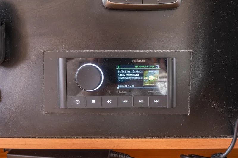 Slide: The Image of Fusion audio system on Lagoon 450 yacht dashboard, displaying music track details. - 143
