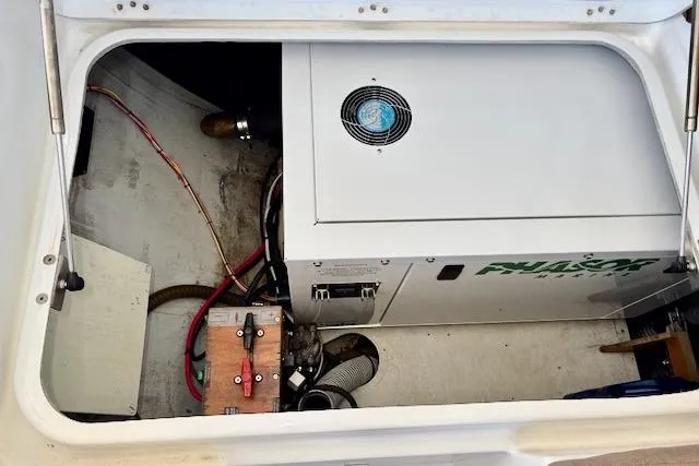 Slide: The Image of 2013 Lagoon 450 catamaran docked, featuring spacious deck and modern design. - 16