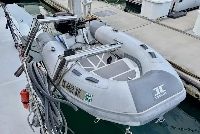 Slide: The Image of Interior view of 2013 Lagoon 450 catamaran with helm, seating, and colorful towels. - 21