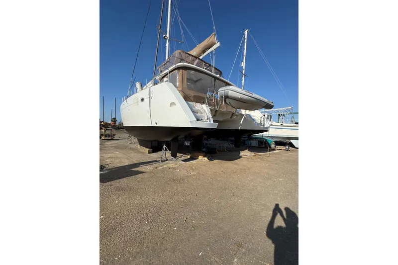 Slide: The Image of Interior view of 2013 Lagoon 450 catamaran cockpit with navigation equipment and ocean view. - 22