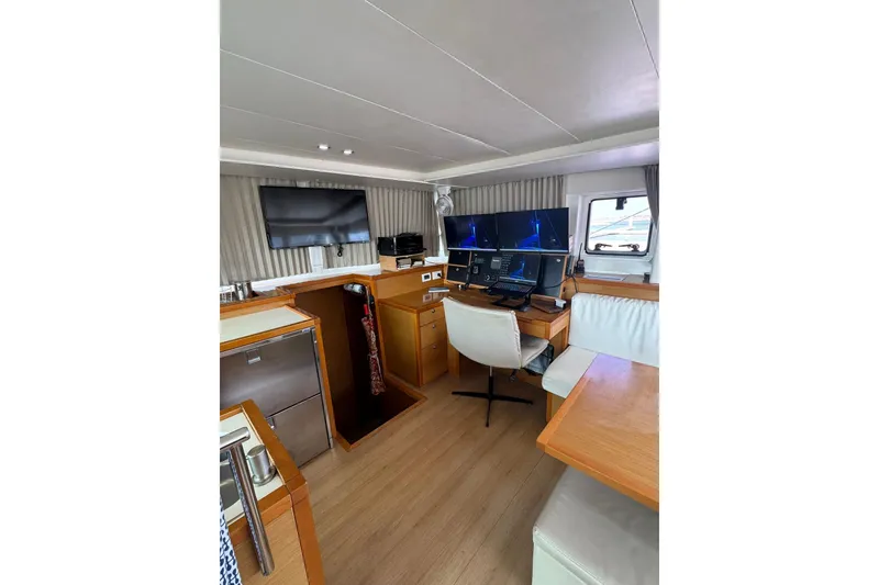Slide: The Image of Interior view of 2013 Lagoon 450 catamaran cockpit with ocean backdrop. - 24