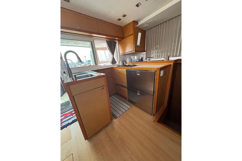 Slide: The Image of Lagoon 450 yacht cockpit with navigation instruments and map display, 2013 model. - 26