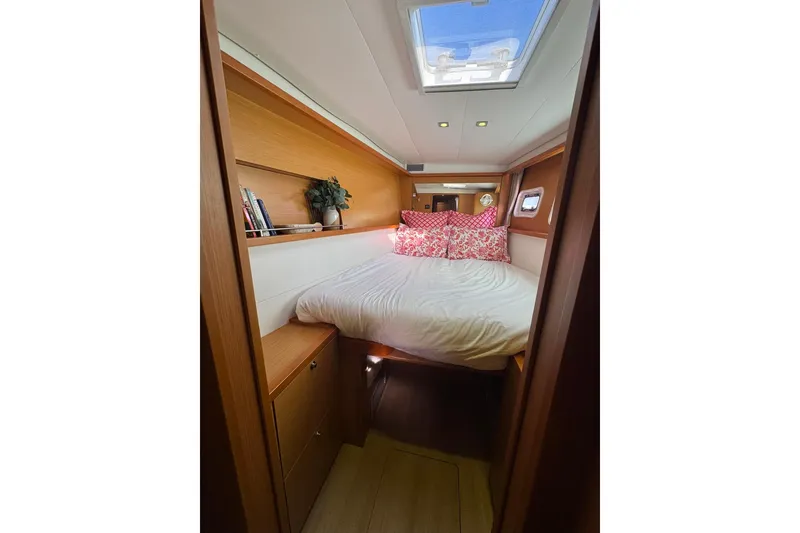 Slide: The Image of Sailing on a 2013 Lagoon 450 catamaran with brown sails over open sea. - 35