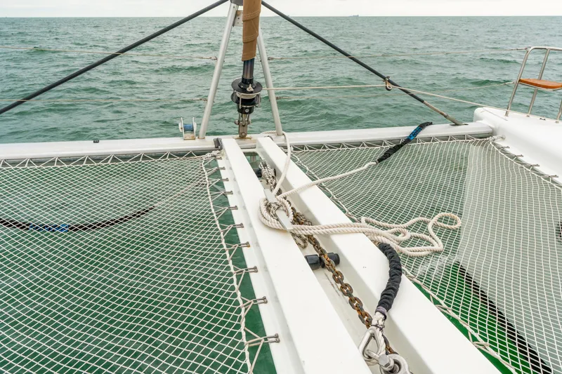 Slide: The Image of Catamaran deck with netting, Lagoon 450, 2013 model, sailing on open sea. - 41