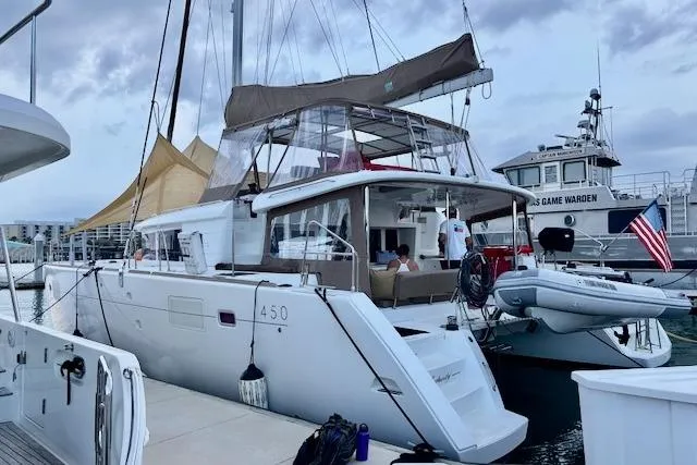 Slide: The Image of Sailing Lagoon 450 catamaran, 2013 model, cruising in coastal waters under clear skies. - 5