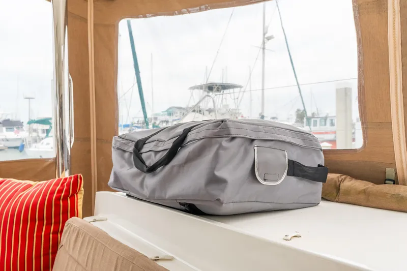 Slide: The Image of Gray bag on Lagoon 450 yacht, 2013 model, with marina view in background. - 57