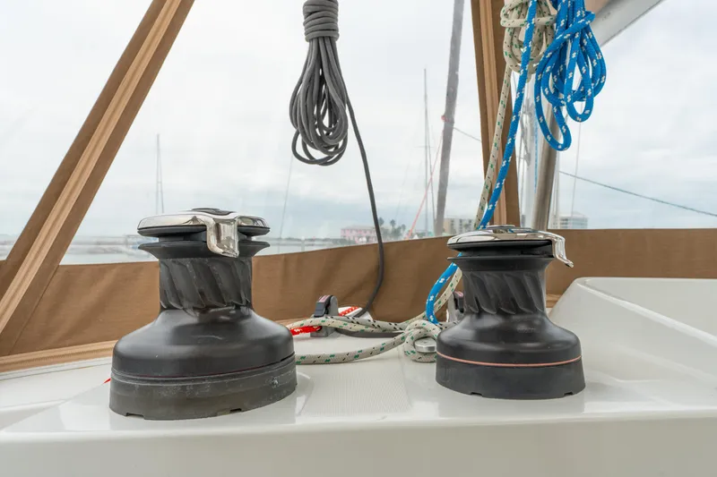Slide: The Image of Winches and ropes on a 2013 Lagoon 450 catamaran deck, ready for sailing. - 63