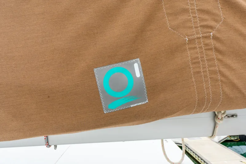 Slide: The Image of Brown sail cover with logo on a 2013 Lagoon 450 catamaran. - 72