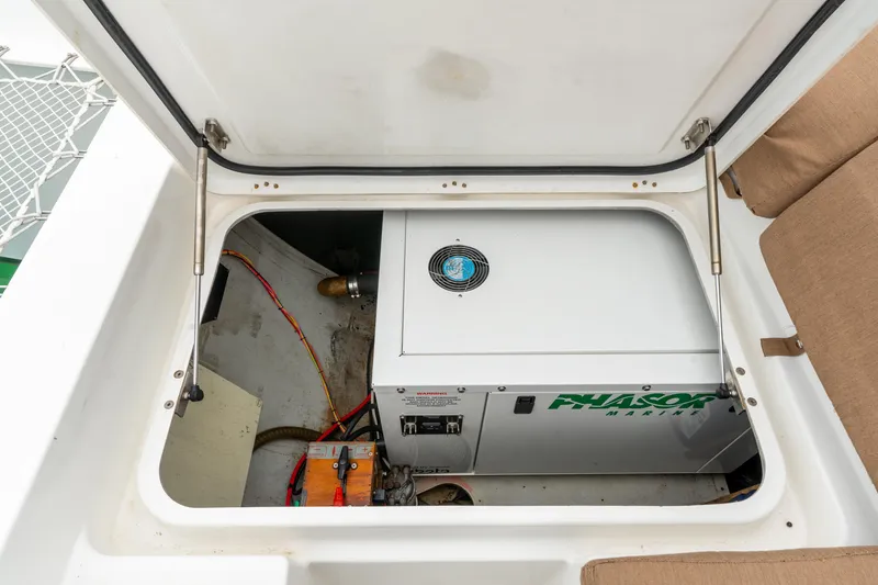 Slide: The Image of Engine compartment of a 2013 Lagoon 450 catamaran with Phasor Marine generator. - 84