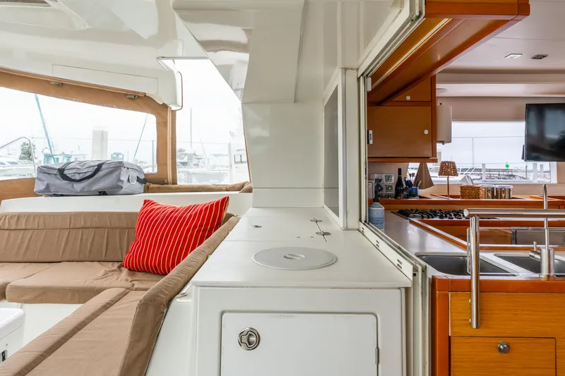Slide: The Image of Interior of 2013 Lagoon 450 catamaran with cozy seating and modern kitchen amenities. - 92