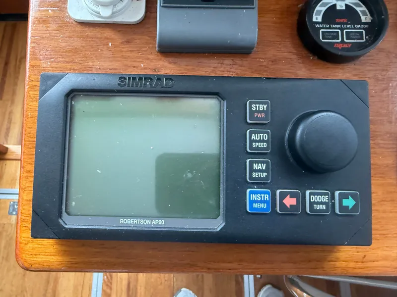 Slide: The Image of Simrad Robertson AP20 autopilot control on 1998 Wilbur 38 Downeast boat dashboard. - 16