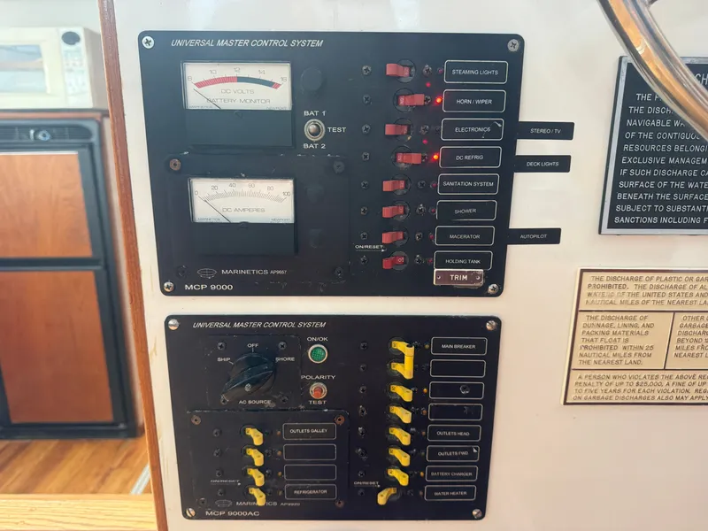 Slide: The Image of Control panel of a 1998 Wilbur 38 Downeast boat with gauges and switches. - 24